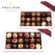 Zwei 18er Pralinenschachteln mit Trüffeln und Pralinen in Sternform