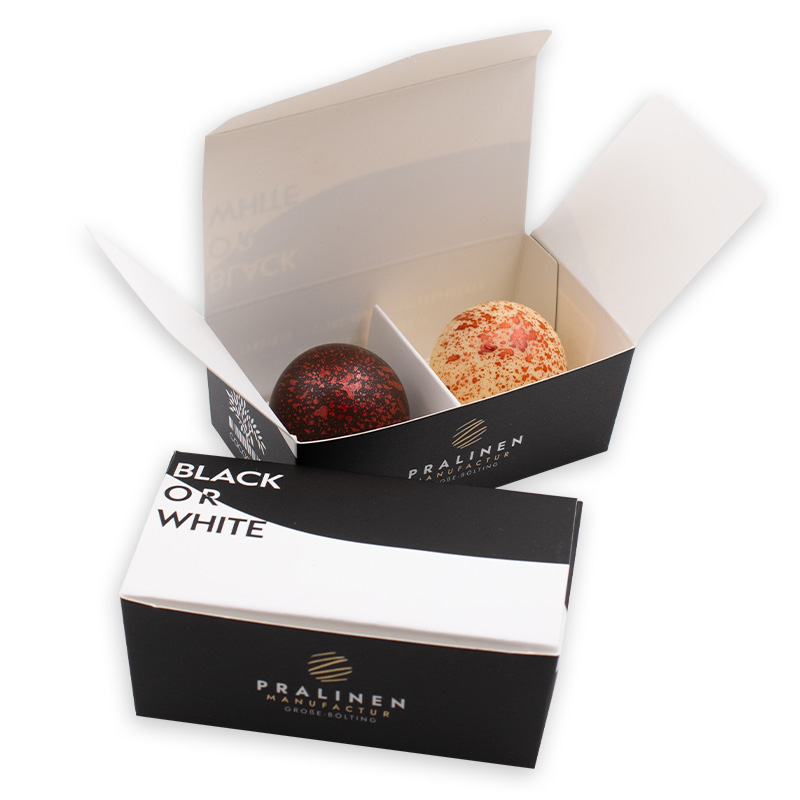 aktionsschachtel-arancia-spritz Aktions 2er Pralinenschachtel mit einer Arancia-Spritz Praline in weißer und einer in dunkler Schokolade